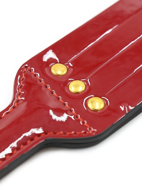 Red Glossy Faux Leather Paddle with Wrist Loop and Gold-Tone Stud Details